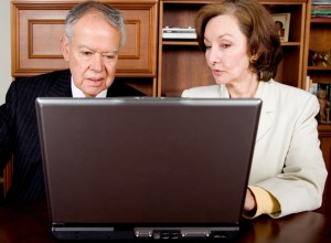 business senior couple on a laptop